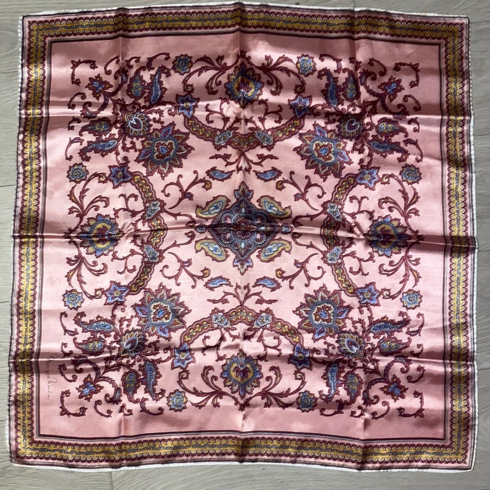 Used, but good condition. It has accents of blue, yellow, and dark pink.